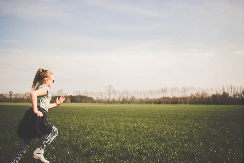 girl playing in yard