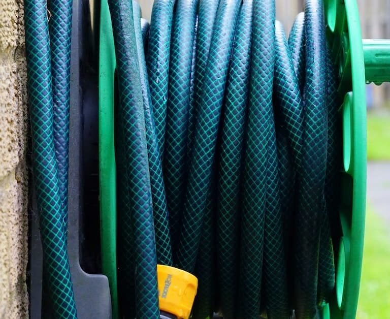 10 Clever Ways To Store Your Garden Hose